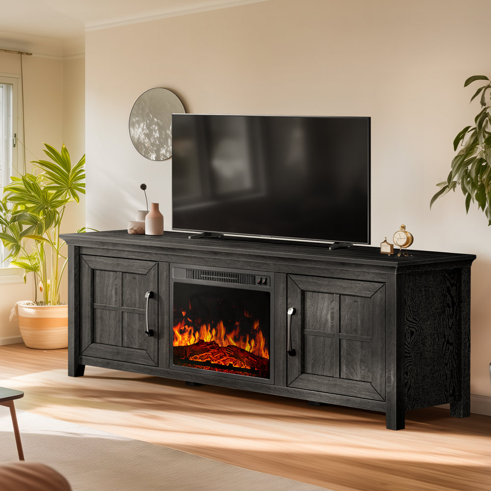 A black wooden TV stand featuring a built-in electric fireplace and two cabinets, positioned in a living room setting.