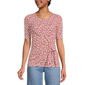 Lands' End Tie-Front Top features a red and white abstract pattern, short sleeves, and a tie detail on the side. Paired with jeans, it offers a casual yet stylish look.
