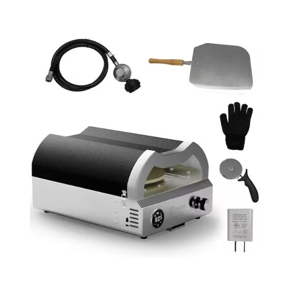 Outdoor pizza oven set with accessories: a gas hose, pizza peel, heat-resistant glove, pizza cutter, and power adapter.