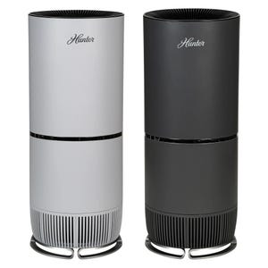 Two cylindrical HEPA tower air purifiers, one in white and the other in black, with vented bases and top air outlets, featuring the \“Hunter\“ logo on the front.