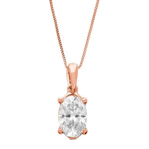 A rose gold pendant necklace featuring an oval-cut clear gemstone set in a four-prong mount, suspended from a fine chain.