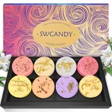 Shower steamers set with eight assorted colorful tablets in a decorative box labeled \“SWCANDY,\“ adorned with floral elements.