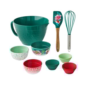 18-piece Pioneer Woman Mixing Bowl Set includes a large green mixing bowl, three measuring bowls with floral designs, a floral-patterned spatula, a green whisk, and four colorful silicone cupcake liners.