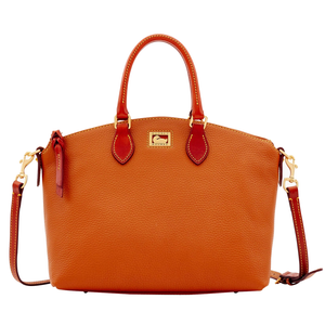 An orange leather handbag with brown handles and a detachable shoulder strap, featuring gold hardware and a Dooney & Bourke logo.