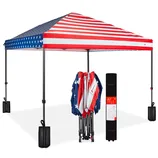 Folding canopy tent with an American flag design, shown fully set up with weights on each leg, and folded next to its carrying case.