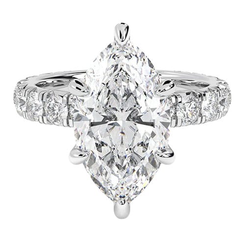 A marquise-cut diamond ring with additional round diamonds set into the band, all in a polished silver or white gold setting.