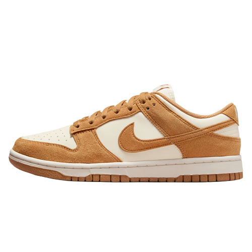 Nike Dunk Low sneakers in tan and cream suede and leather. Features a classic low-top design with a swoosh logo.