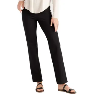 A person is wearing black boot-cut trousers and flat sandals.