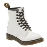 A white lace-up boot with black laces, featuring a classic 8-eye design and signature yellow stitching on the sole, commonly associated with Dr. Marten's 1460 W style.