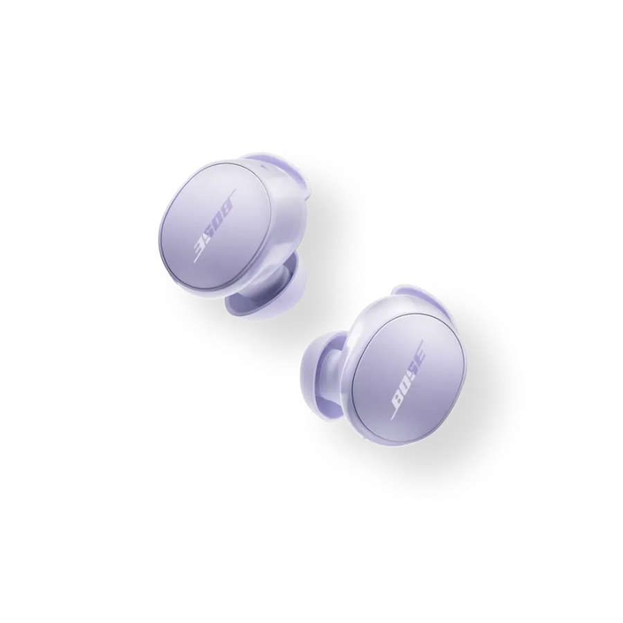 Bose QuietComfort Earbuds in purple, featuring a sleek, round design with the Bose logo on each earbud, known for offering noise-canceling capabilities and a comfortable fit for enhanced audio experiences.