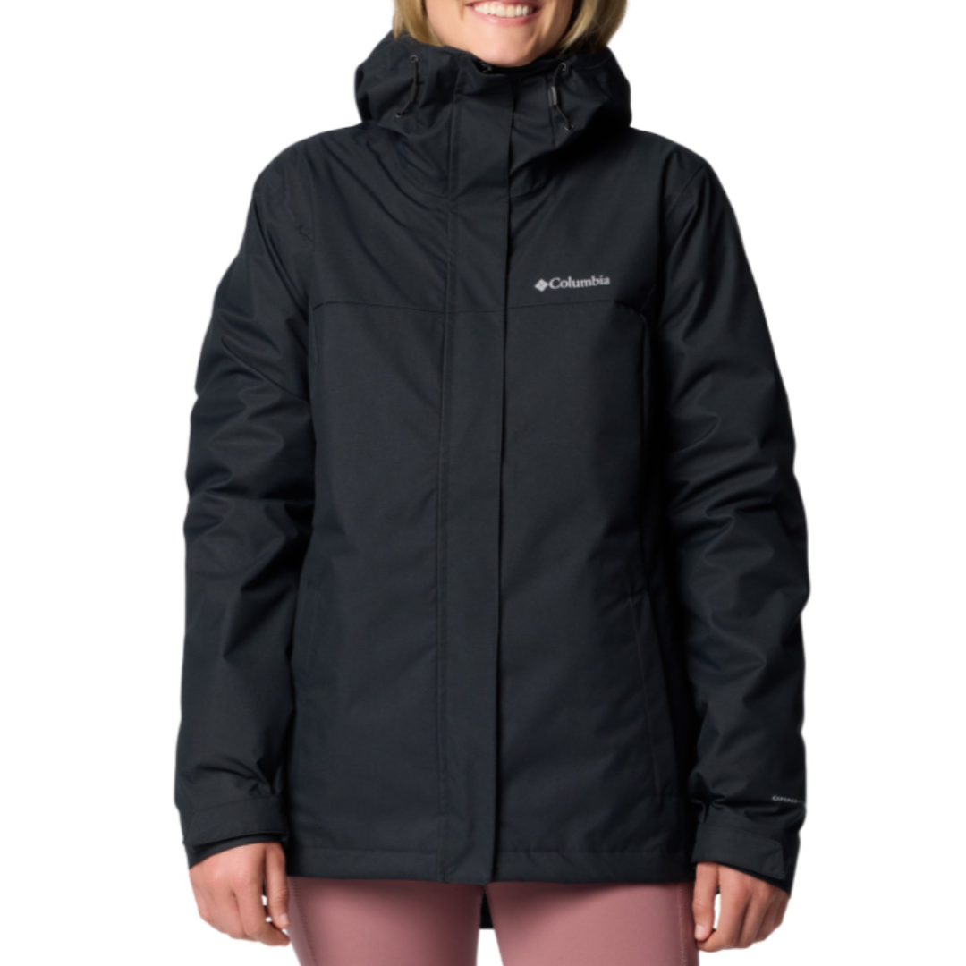 A black Columbia jacket with a hood, featuring the Columbia logo on the front left side, paired with pink pants.