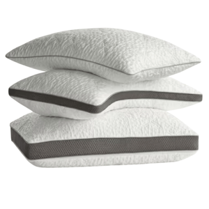 A stack of three white pillows with dark gray trim, each featuring a textured pattern on the fabric.