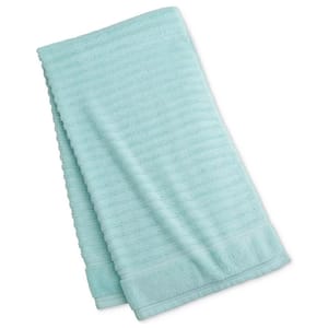 Light blue bath towel with a subtle striped pattern.