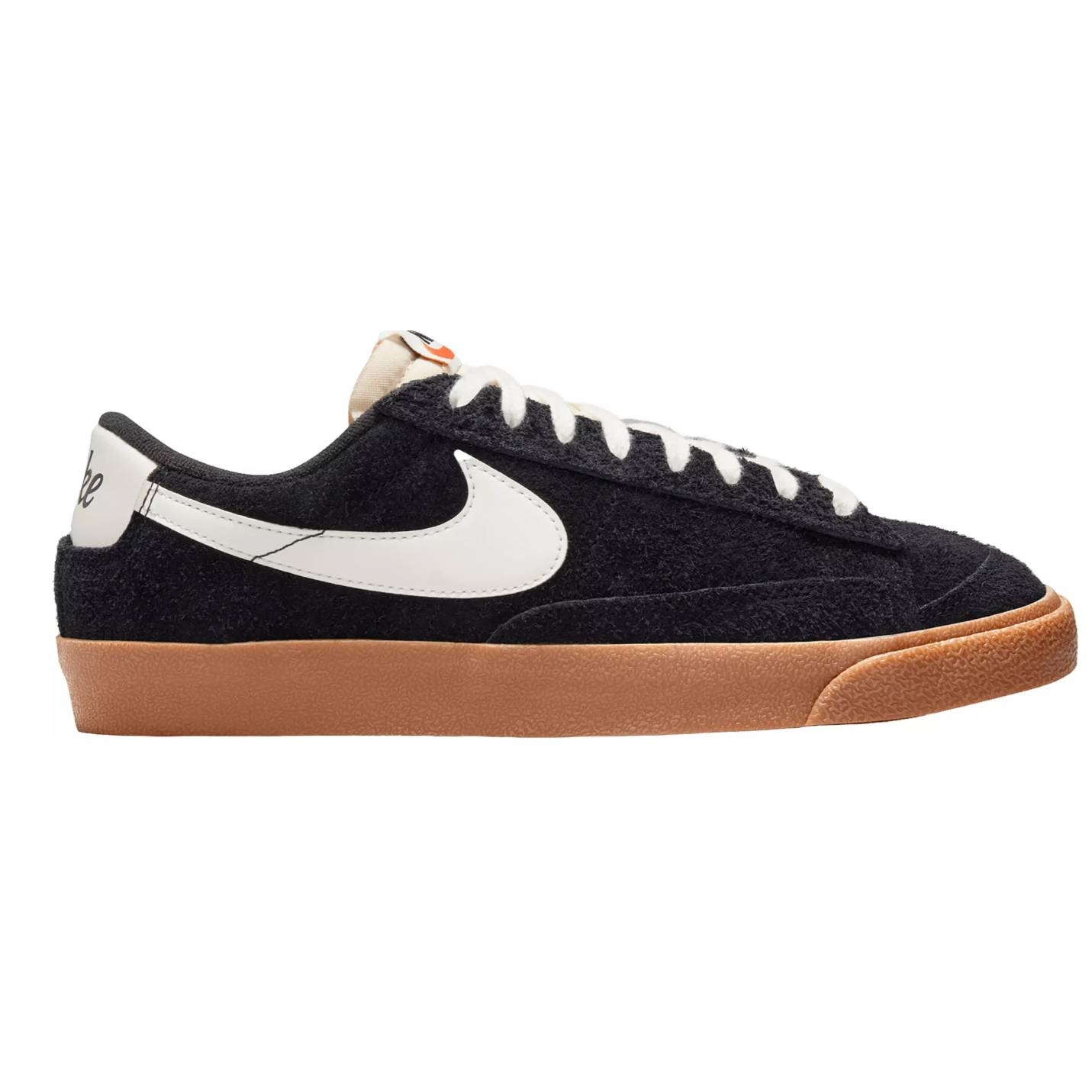 A black and white Nike sneaker with a brown gum sole.