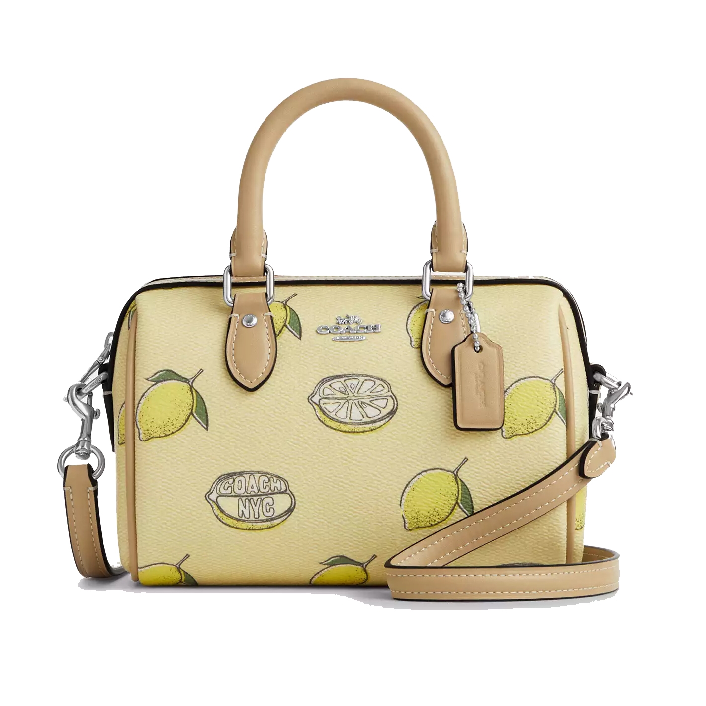 Coach handbag featuring a lemon print design, with beige handles and detachable strap.