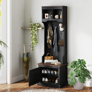 Hall tree with storage bench, coat hooks, and shoe storage shelves, accompanied by hanging jackets, hats, and a plant.
