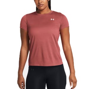 A woman is wearing a pink Under Armour short-sleeve t-shirt with a small logo on the chest, paired with black leggings.