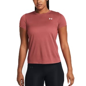 A woman is wearing a pink Under Armour short-sleeve t-shirt with a small logo on the chest, paired with black leggings.