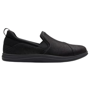 A black slip-on shoe with a low-profile design, featuring a soft upper and a cushioned sole for comfort.