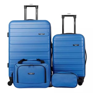 Blue 4-piece hardside luggage set includes two suitcases with wheels and telescoping handles, a carry-on bag, and a toiletry bag. All pieces feature a uniform design with horizontal grooves and \“Travelers Club\“ branding.