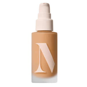 A bottle of liquid foundation with a pump dispenser, featuring a large stylized \“N\“ on the front.