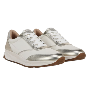 Naturalizer Jackson Lace Up Sneaker features a white base with metallic silver accents, white laces, and brown rubber soles, offering a stylish and comfortable design.