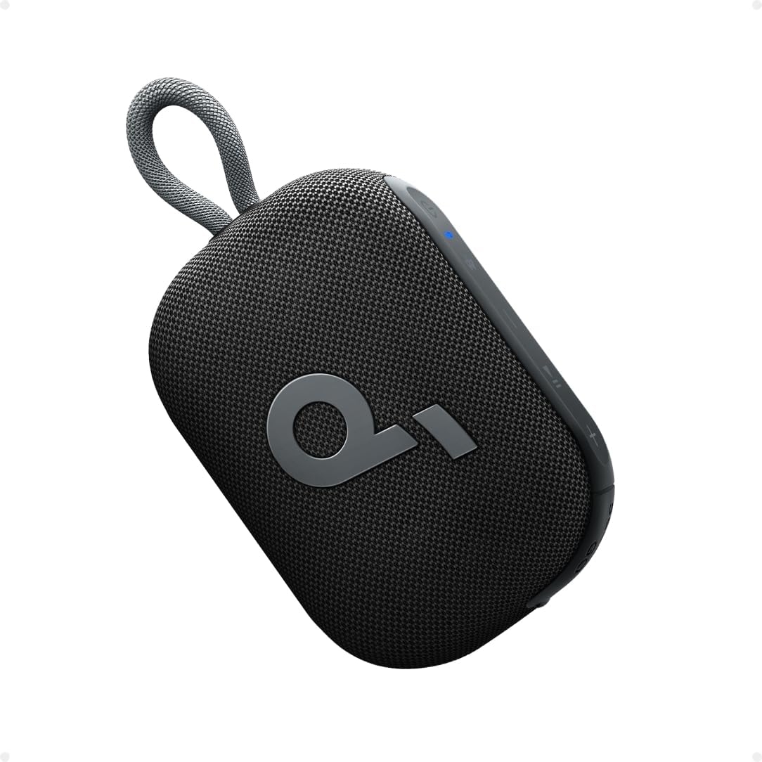 A compact, black portable speaker with a textured fabric cover, featuring a prominent \“q\“ logo, volume controls on the side, and an integrated hanging loop for easy portability.