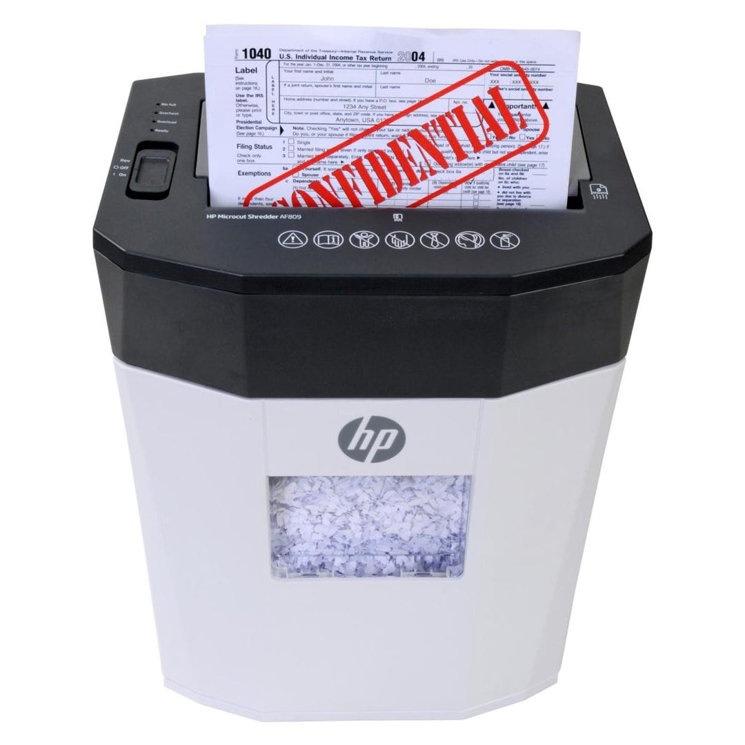 HP Microcut Shredder AF809 with a sheet labeled \“CONFIDENTIAL\“ and a shredded paper bin.