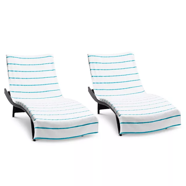 Two ergonomic chaise lounge chairs with white terry towel covers featuring horizontal teal stripes.