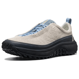 A sneaker with a textured beige upper, blue laces, and black rugged sole, suitable for outdoor activities.