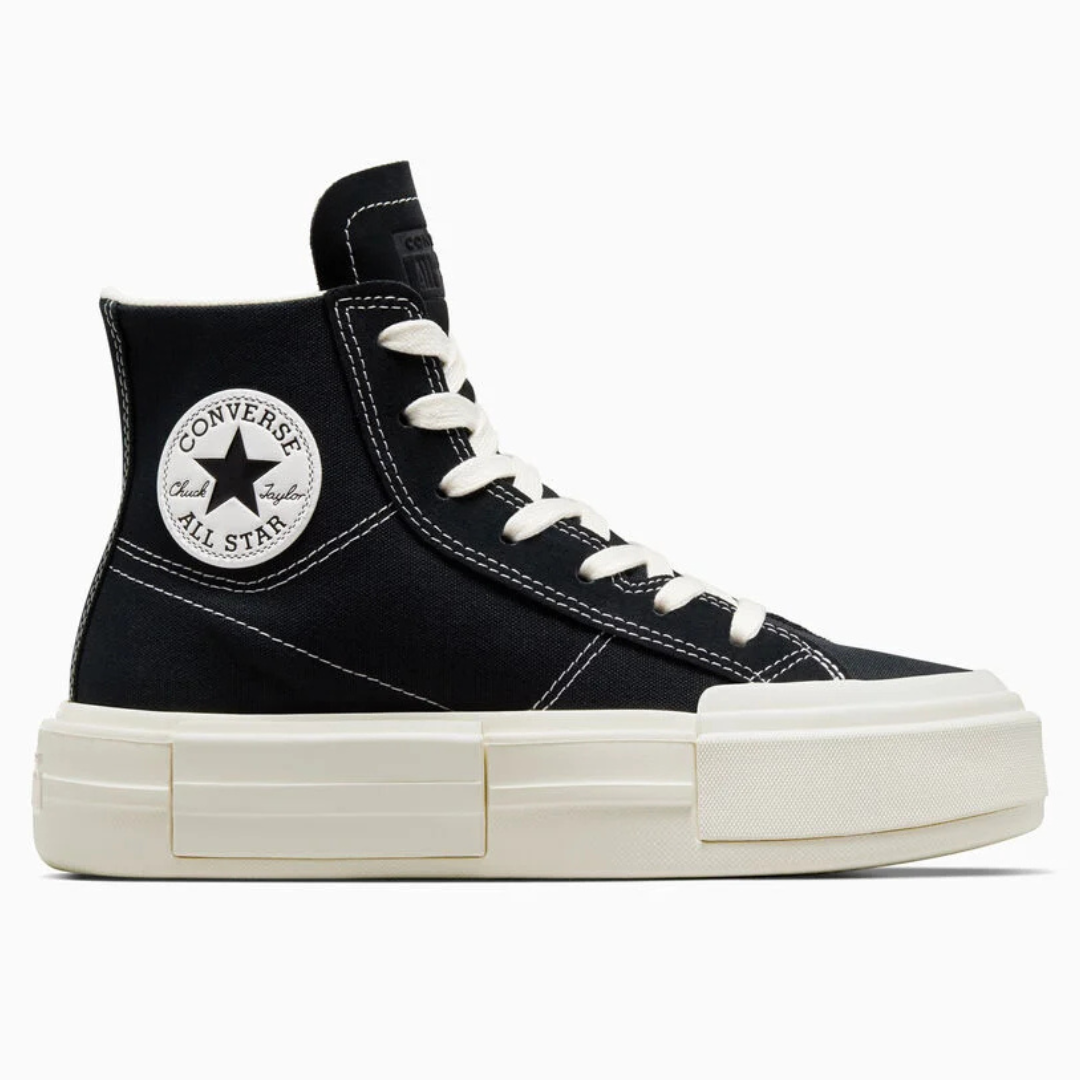 Black and white high-top platform sneakers with a classic star-centered circular logo on the side.