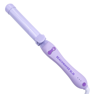 A purple Beachwaver B1.25 curling iron with a rotating barrel and adjustable temperature settings.
