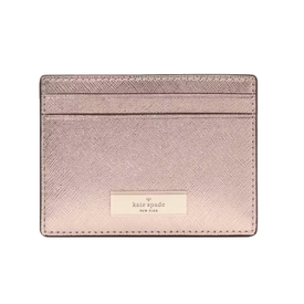 The Kate Spade Kenzie Metallic Card Holder is a sleek, shimmering pink accessory with two card slots and a gold logo plaque on the front.