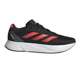Black athletic shoe with red stripes and a white sole.
