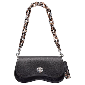 A black textured leather bag with a unique wave-shaped flap, featuring a silver clasp and an attached tortoiseshell chain strap.