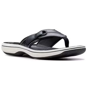 Black flip-flop sandal with a contoured footbed, white and black sole, and a fabric strap featuring a decorative loop detail.
