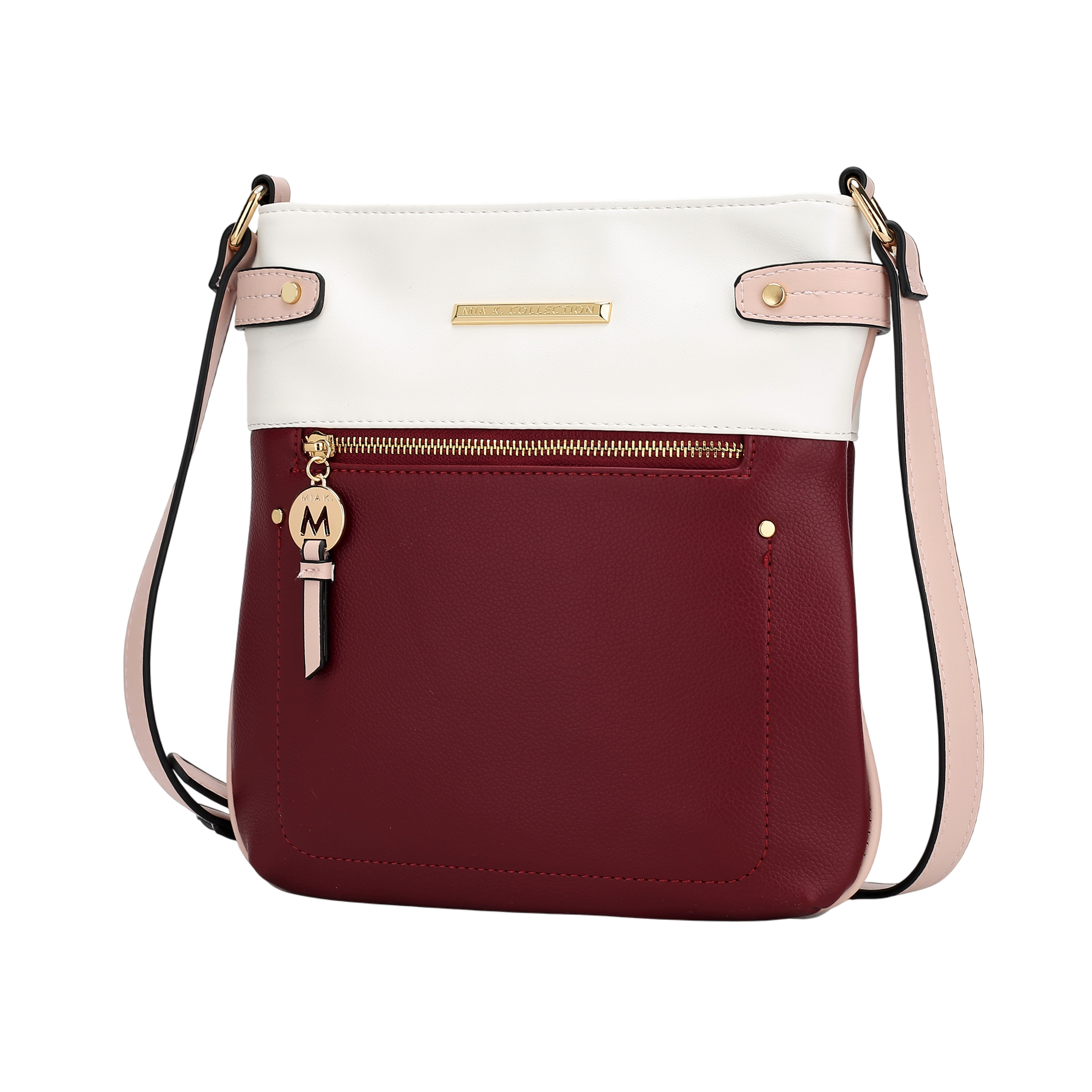A two-tone crossbody bag featuring a burgundy pocket with a gold zip and a white upper section. Accented with a pink strap and gold hardware, including a charm with an \“M\“ emblem.