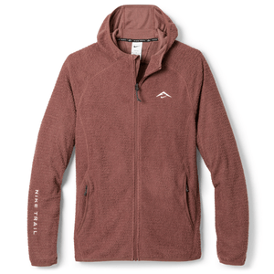 A brown fleece zip-up hoodie with a hood, featuring \“Nike Trail\“ branding on the left sleeve and a small logo on the chest.