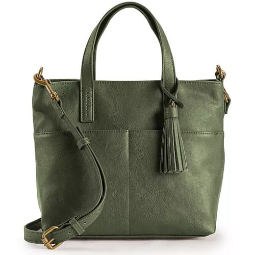 A green leather tote bag with dual handles, a detachable crossbody strap, and a tassel accent.