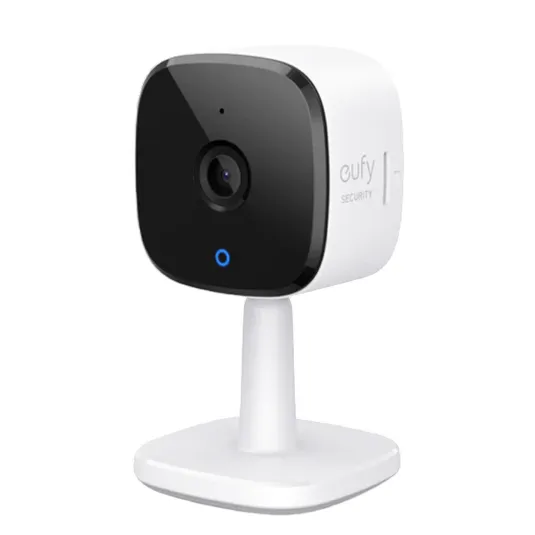 A Eufy security camera with a compact design, featuring a black front panel, lens, and a white stand for indoor use.