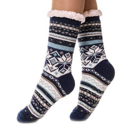 Sherpa slipper socks with a cozy fleece lining and snowflake pattern in blue, white, and black tones, featuring reinforced heels and toes for added warmth and comfort.