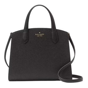 A black Kate Spade New York handbag with dual top handles and a shoulder strap, featuring a structured design and the brand's logo in gold lettering on the front.