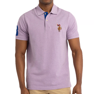 A light purple US Polo Assn. polo shirt featuring short sleeves, a two-button closure, and an embroidered polo player logo on the chest. The right sleeve has a large blue \“3\“ logo.