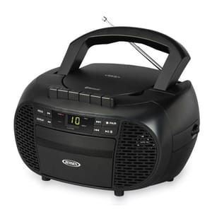 Jensen portable stereo system with Bluetooth, CD player, cassette deck, and radio, featuring digital display and built-in speakers. Compact and black with a carrying handle and antenna.