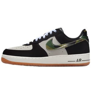 Nike Air Force 1 sneaker featuring a black, gray, and white color scheme with a camo-patterned Nike swoosh and gum sole.