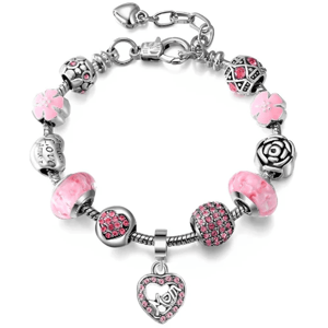 A charm bracelet with pink and silver beads featuring floral designs, a rose motif, and a heart-shaped charm encrusted with pink crystals.