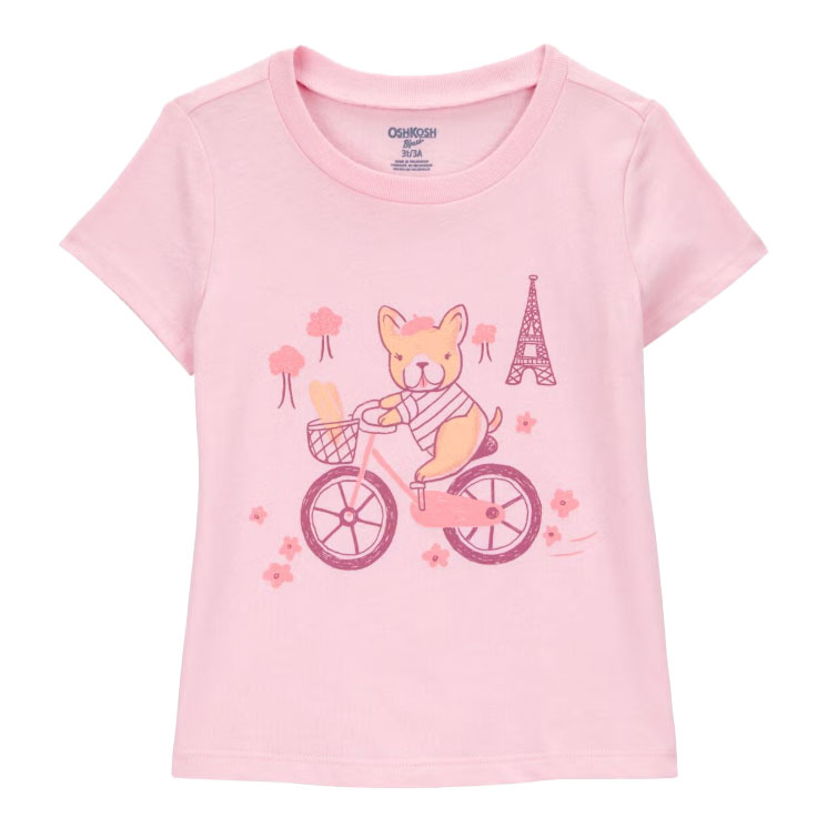 Pink toddler girls' T-shirt featuring a cute dog riding a bicycle, with a basket holding bread and an Eiffel Tower illustration in the background, embellished with flowers and trees.