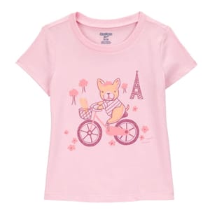 Pink toddler girls' T-shirt featuring a cute dog riding a bicycle, with a basket holding bread and an Eiffel Tower illustration in the background, embellished with flowers and trees.