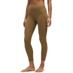 A person is wearing high-waisted, brown leggings with a sleek, seamless design.