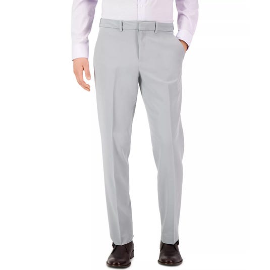 Light gray dress pants paired with a light-colored dress shirt and dark brown shoes.